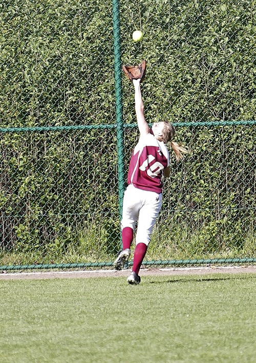 Thomas Jefferson outfielder Lexi Goranson attempts to catch up with a ball hit during the Raiders' 8-1 win over Emerald Ridge Thursday at the SPSL Tournament at Kent's Service Fields. The Raiders earned the SPSL's fourth seed into the West Central District Tournament