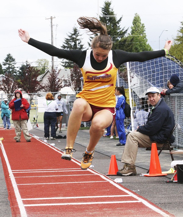 Thomas Jefferson sophomore Lindsey Dahl completes a triple jump Friday afternoon at the West Central District Track and Field Meet at Mount Tahoma High School. Dahl finished second in the event and also qualified for state in the javelin and 300-meter hurdles.