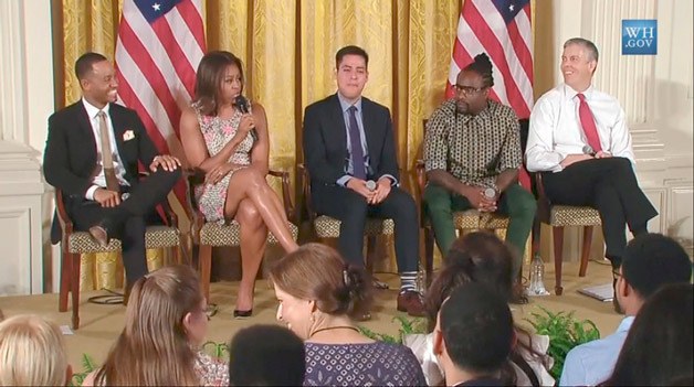 Devon Adelman (second from left with her back to the camera) and her mother enjoy front row seats recently at First Lady Michelle Obama's Reach Higher 'Beating the Odds' summit.