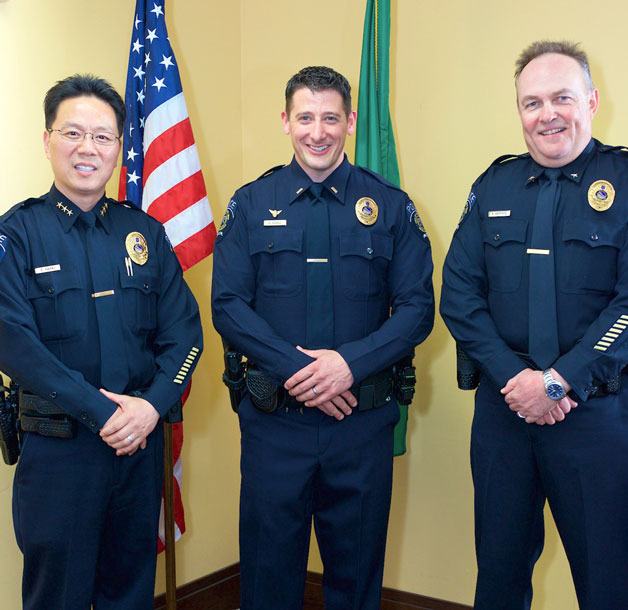 Chief of Police Andy Hwang (left) recognized Commander Brett Hatfield (right) and Lieutenant Brigham Schulz (center) during a promotion ceremony on Wednesday.