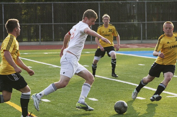 Federal Way senior Jacob Thoreson dribbles through the Lake Stevens defense during the Raiders' state game. Thoreson was named All-SPSL North by the league's coaches.