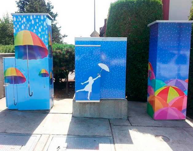 Utility boxes in front of the Red Robin restaurant in Federal Way display colorful umbrellas. The city of Federal Way Art Commission has put out a call to artists requesting interesting