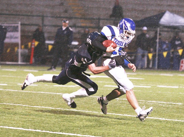 Federal Way High School senior Nick Tanielu returns for his third year as the Eagles’ starting quarterback. Last year