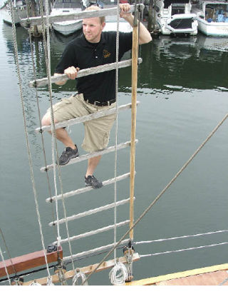 Peter Denton prepares to raise flags on the Amazing Grace tall ship out of Gig Harbor. The ship will be one of many to visit Foss Waterway July 3-7 during the Tall Ships Tacoma 2008 festival