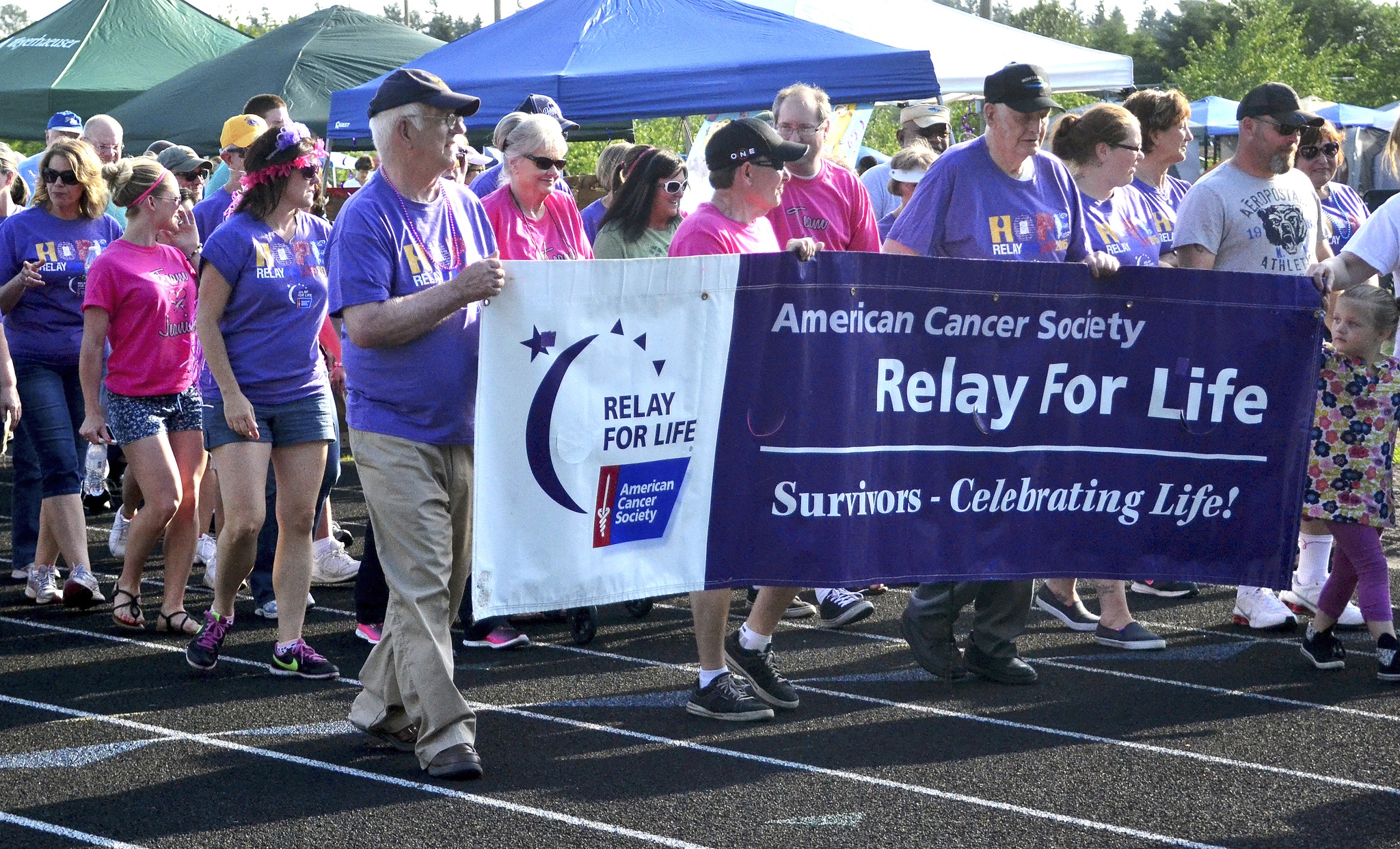 Participants at last year's Relay for Life of Federal Way event walk around the track. They raised $58