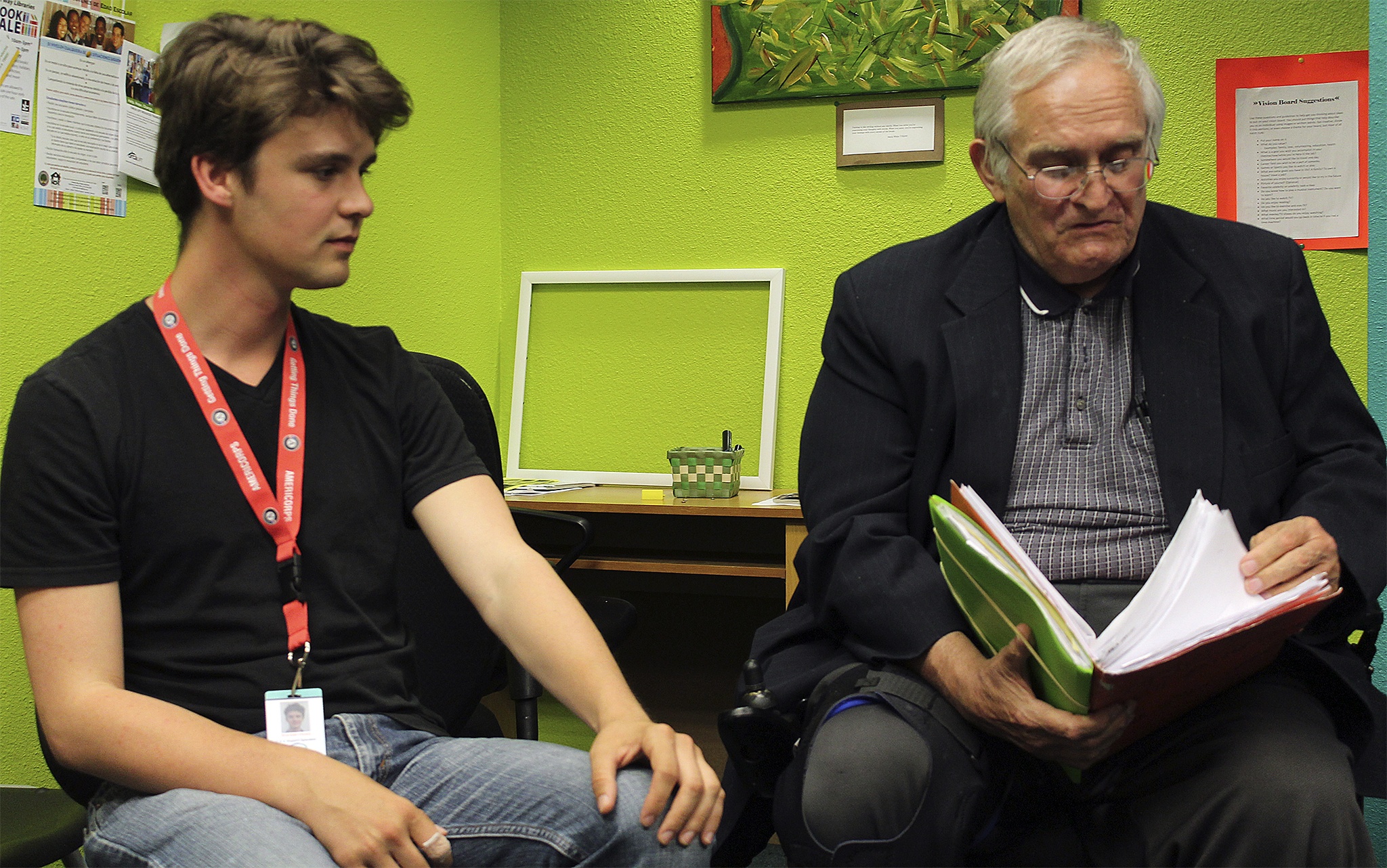 John Hyde (right) reviews work he's done for the Job Readiness Training program