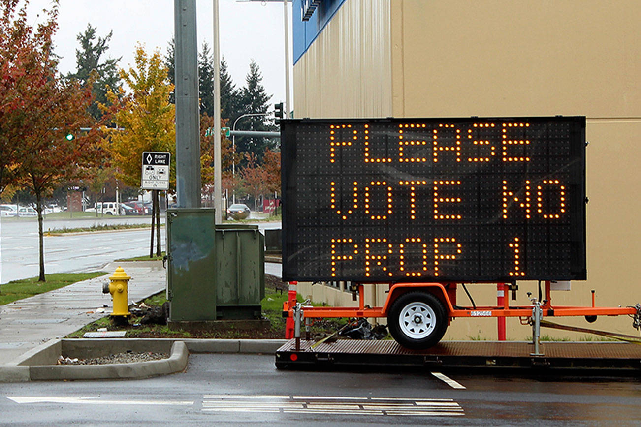 ‘I will pay the fines’: Property owner violates city code with large sign opposing marijuana retail in Federal Way