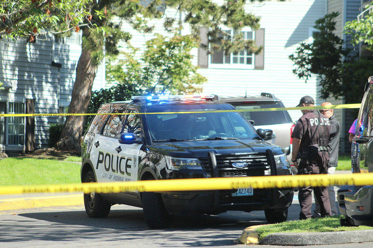 Federal Way police officers investigate a crime scene in 2019. Olivia Sullivan/staff photo