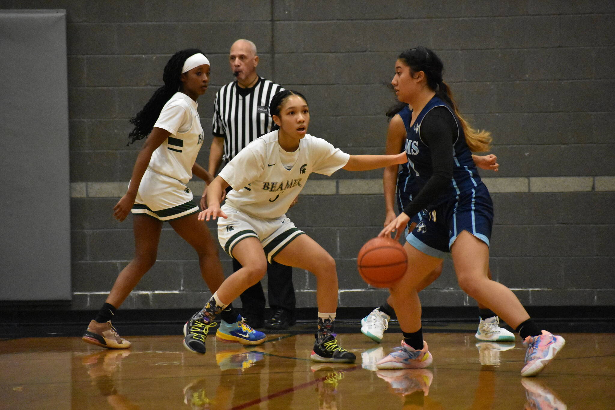 Aaliyah Chappel plays tough defense against Mt. Rainier. Photo Credit: Ben Ray/ The Mirror.