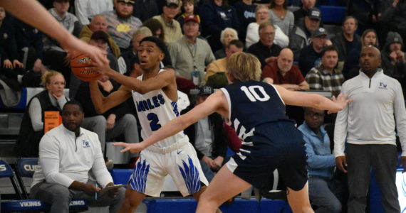 Eagle senior Dae’sean Johnson-Holiman looks for a teammate against Olympia. Ben Ray / the Mirror