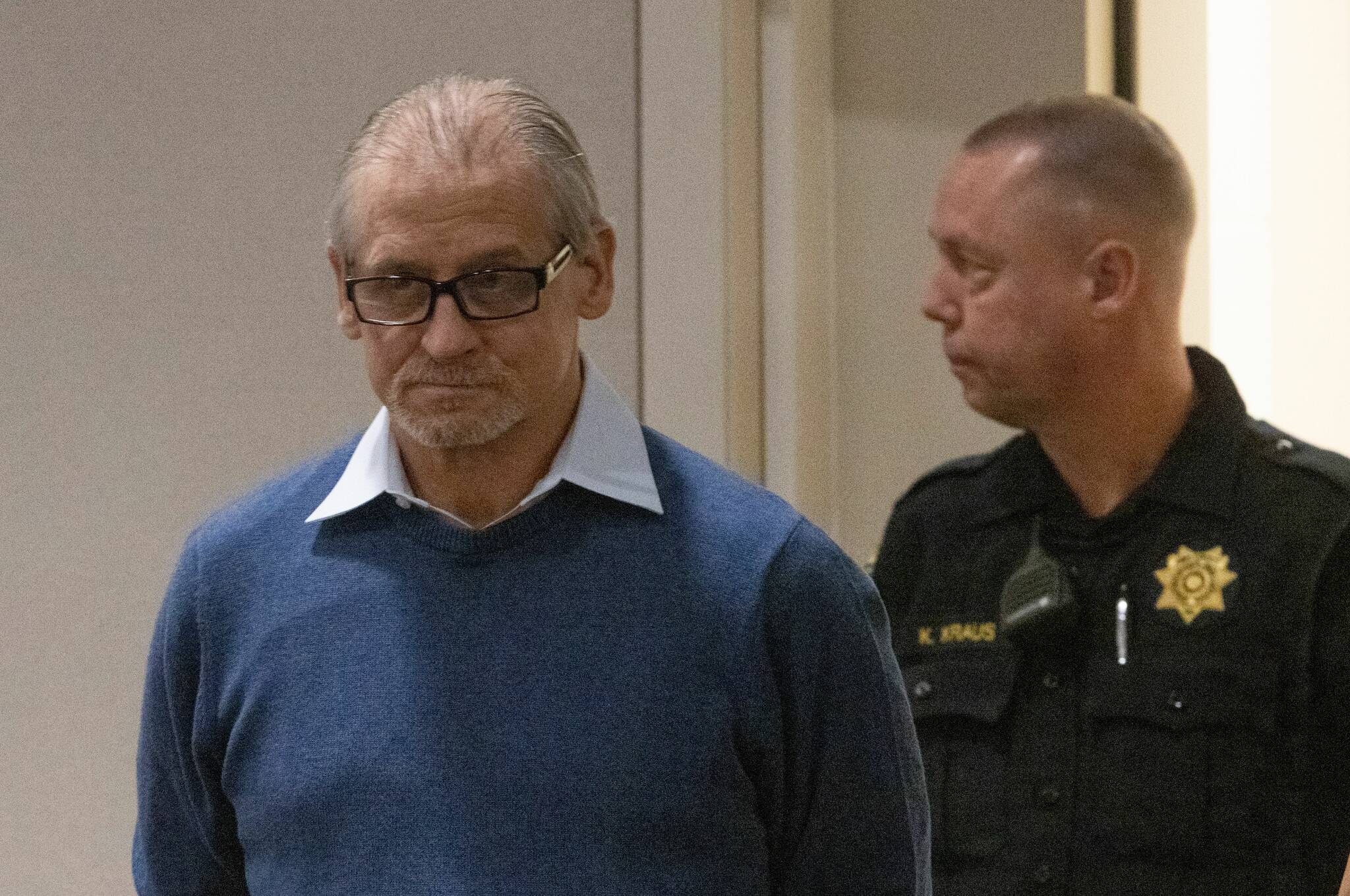 Patrick Nicholas, 59, enters the courtroom Monday, April 17, 2023 at the Maleng Regional Justice Center in Kent. He is standing trial for the December 1991 killing of 16-year-old Sarah Yarborough. Ellen M. Banner/The Seattle Times