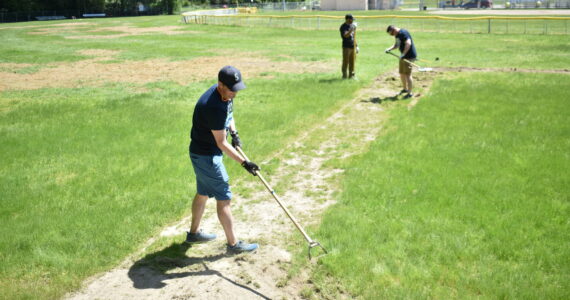 Volunteers helping out on Federal Way National field 4. Ben Ray/ The Mirror