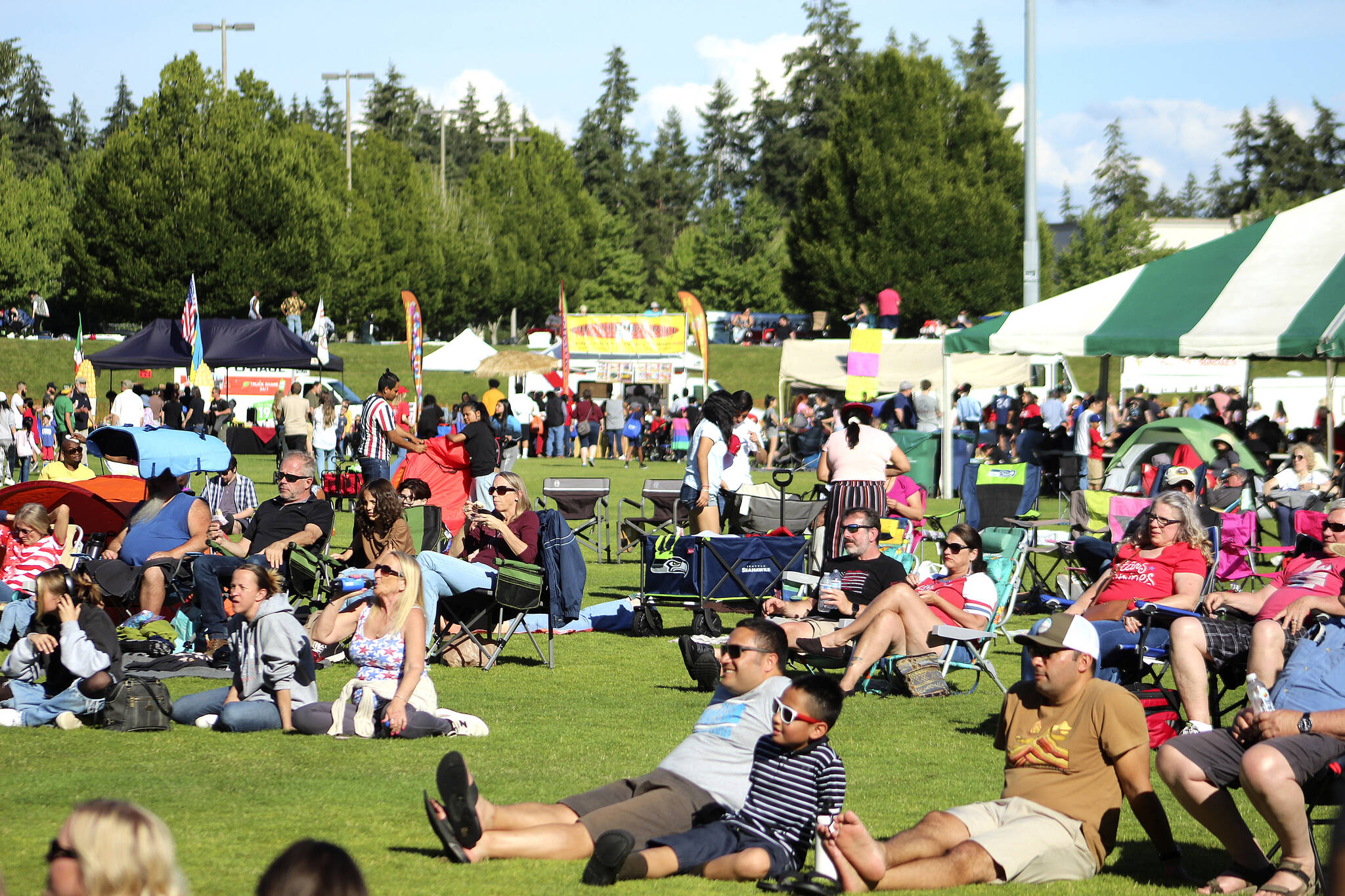 Olivia Sullivan / The Mirror 
People enjoy live music at Celebration Park on July 4, 2022.