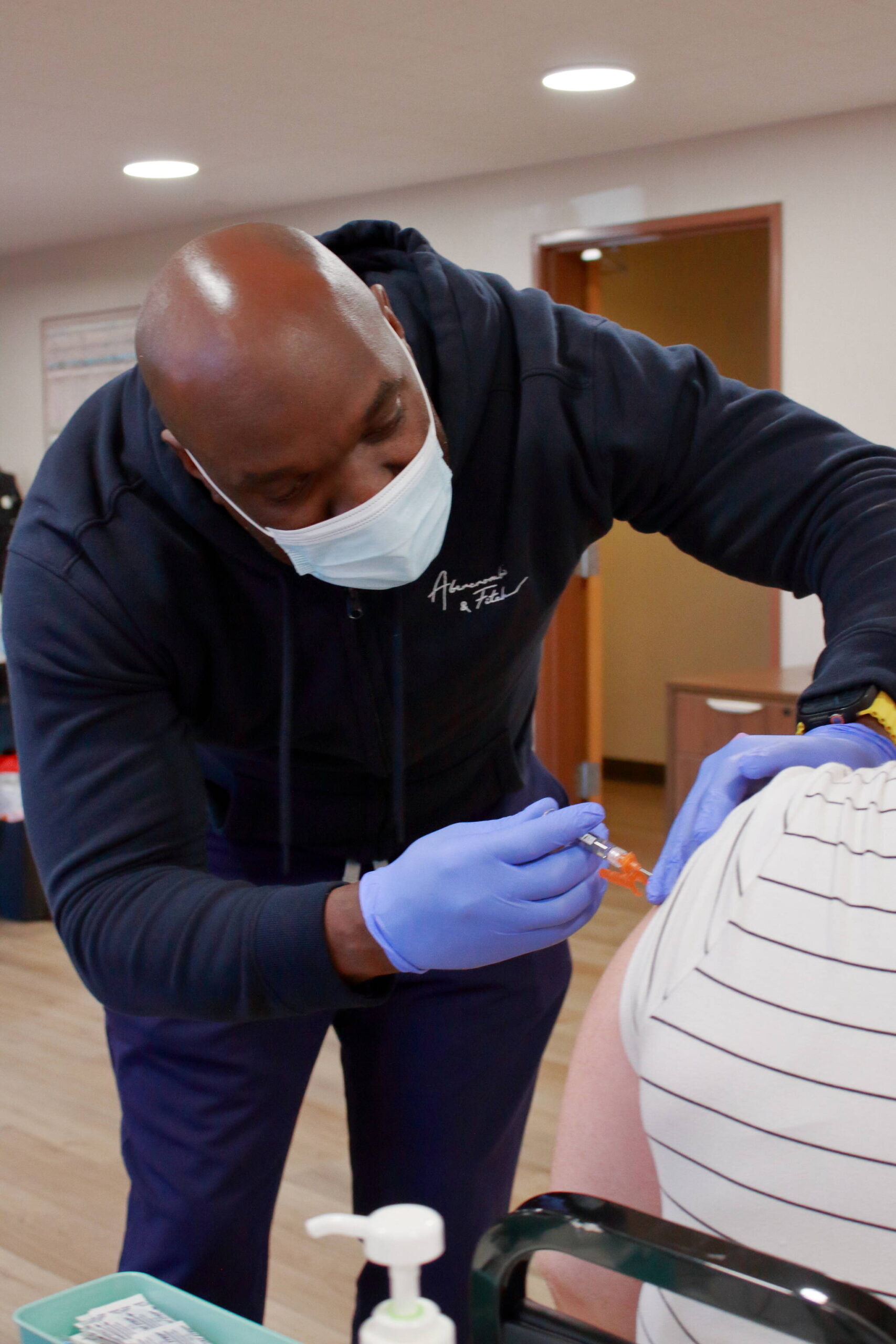 Courtesy photo
Robert Ododa, L.P.N., administers a vaccine to a community member at the free vaccine clinic at FUSION.