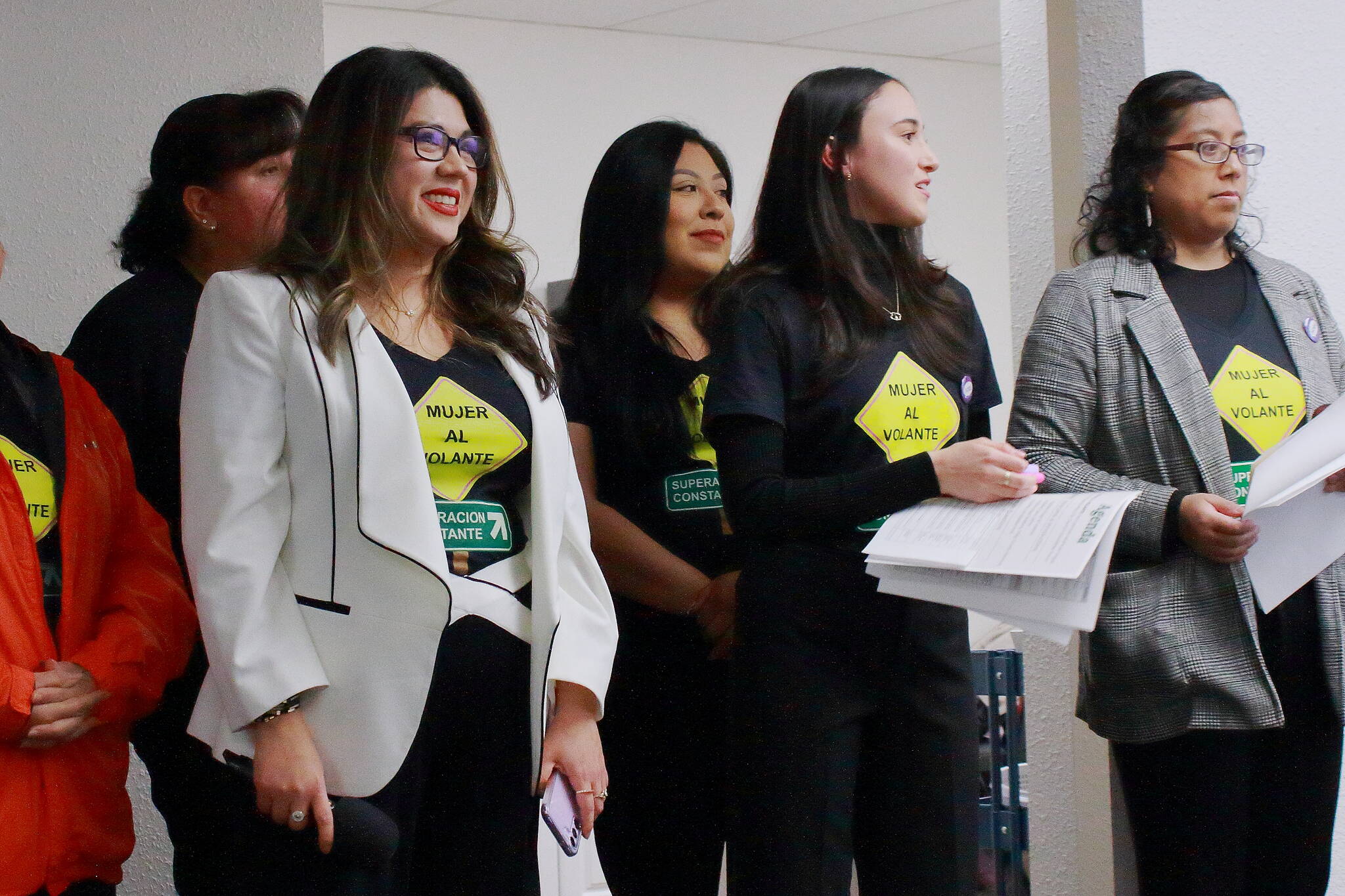 Jaqueline Garcia Castillo and her team at Mujer Al Volante watch Federal Way City Council candidates as the speak to voters at a forum on Wednesday. Photo by Keelin Everly-Lang / The Mirror