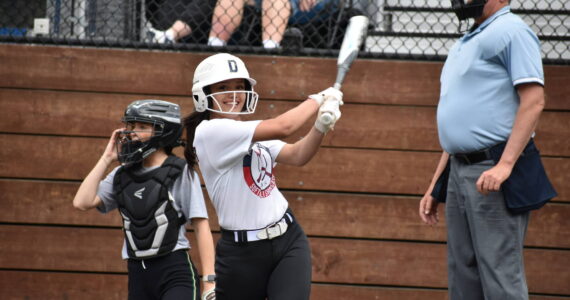 Decatur’s Luci Pech gives a smile during a practice swing. Ben Ray / The Mirror