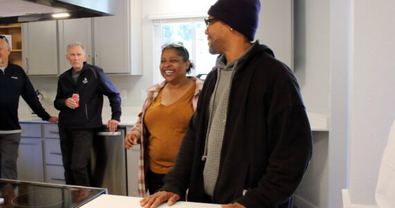 December and Keith see the home they will be living in for the next six to nine months for the first time. Photo by Keelin Everly-Lang / The Mirror