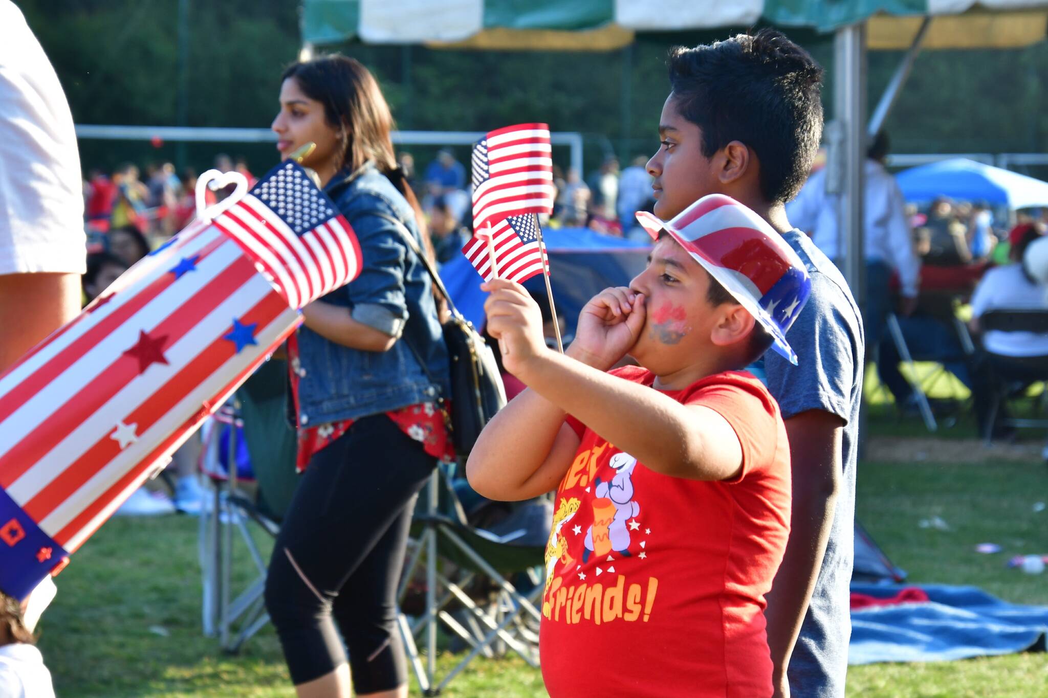 Visitors at Celebration Park celebrating the birthday of the United States at a past Federal Way Red, White and Blues Festival. File photo by Bruce Honda.