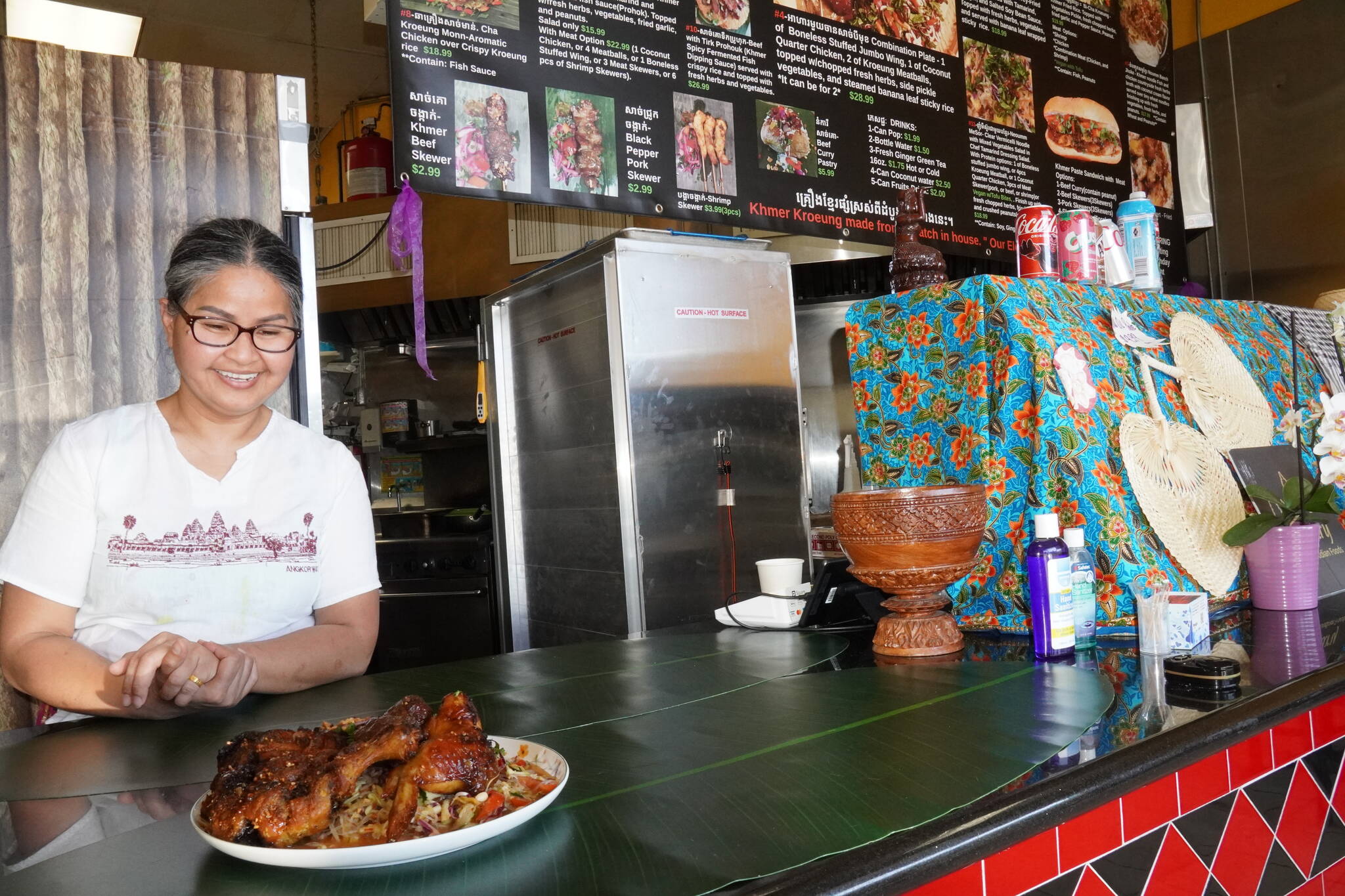 Theary Ngeth with her combination plate. Photo by Joshua Solorzano/The Mirror