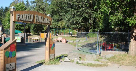 Next to the entrance to the Steel Lake Park playground in Federal Way, the inclusive AbilityWhirl can be seen behind fencing, closed off to the public as of July 10, 2024. Photo by Max Burchi / The Mirror.