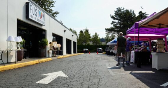 The FUSION Summer Marketplace’s first row of booths by the FUSION Boutique sign. Photo by Joshua Solorzano/The Mirror