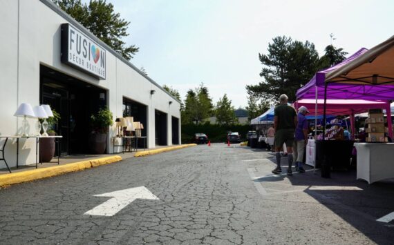 The FUSION Summer Marketplace’s first row of booths by the FUSION Boutique sign. Photo by Joshua Solorzano/The Mirror