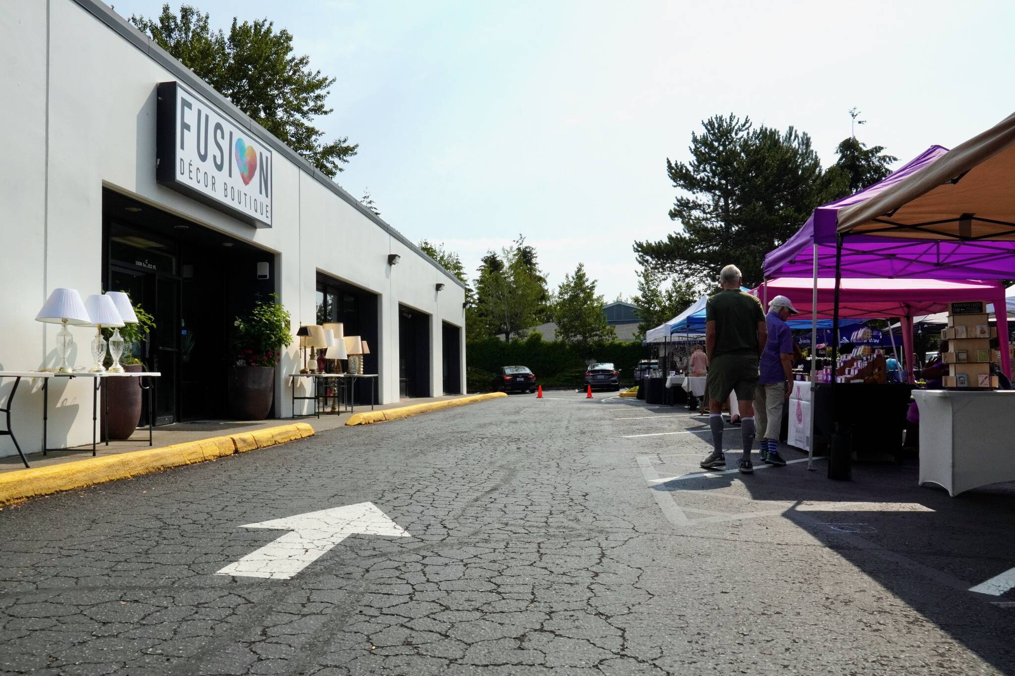 The FUSION Summer Marketplace’s first row of booths by the FUSION Boutique sign. Photo by Joshua Solorzano/The Mirror