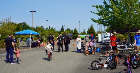 Kids riding bikes, and families learning about bikes, on July 27 at the Bicycle Safety Event in Federal Way. Photo by Joshua Solorzano/The Mirror