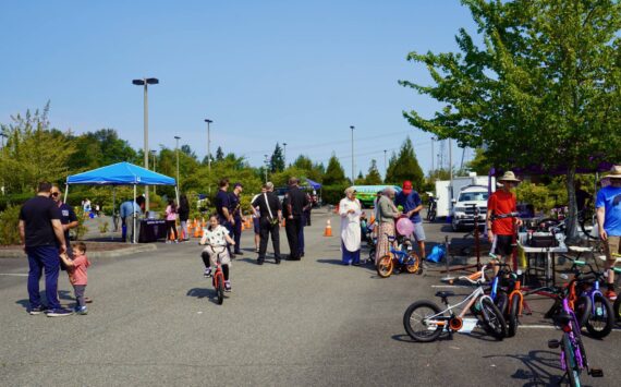 Kids riding bikes, and families learning about bikes, on July 27 at the Bicycle Safety Event in Federal Way. Photo by Joshua Solorzano/The Mirror