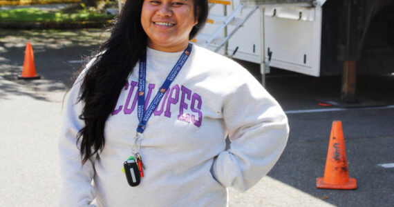 Arleen Marston is the wellness programming manager at PICA-WA. At their third annual health and resource fair July 31 in Federal Way, free mammograms were offered in the truck behind her. Photo by Keelin Everly-Lang / The Mirror