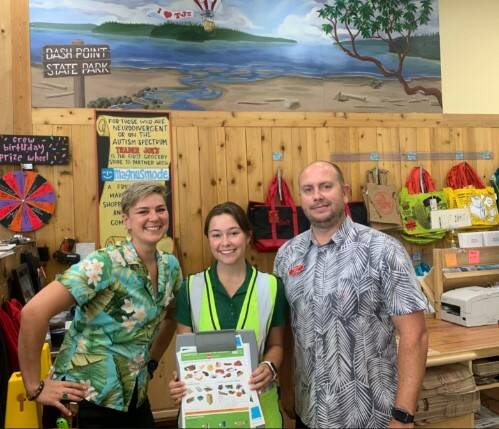 Recycling interns meet with staff at Trader Joe’s grocery store in Federal Way to share tips on sorting waste. Photo provided by WM