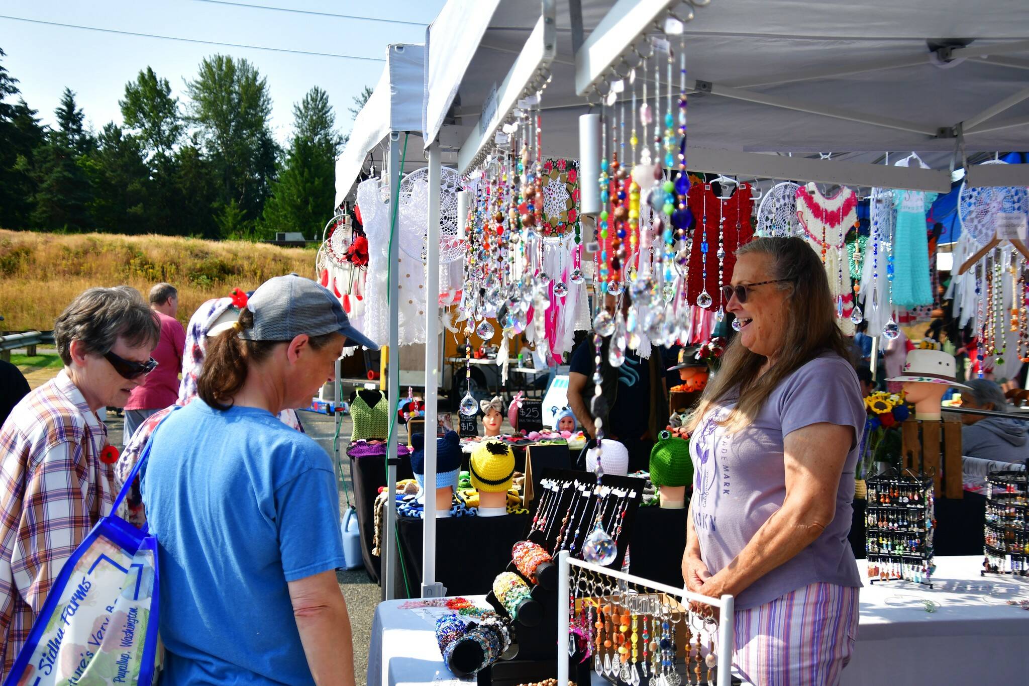 The community enjoyed a sunny Federal Way Farmers Market on Saturday, July 27. The market is open 9 a.m. to 4 p.m. Saturdays at The Commons mall parking lot. Photo by Bruce Honda