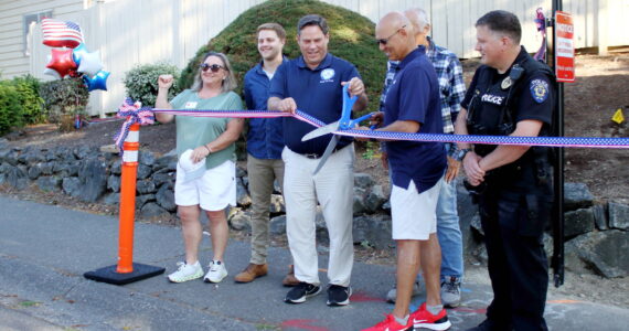 Local leaders cut the ribbon Aug. 6 for a new license plate scanning camera that is intended to increase public safety in the Westridge neighborhood in Federal Way. Photo by Keelin Everly-Lang / the Mirror