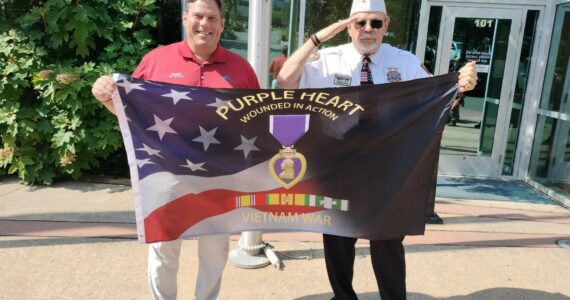 Federal Way Mayor Jim Ferrell and Roger Flygare with the Purple Heart flag before it was raised. Photo courtesy of Bill Vadino