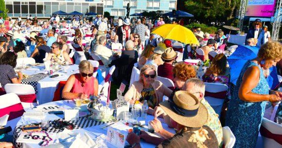 The lawn was packed with guests at FUSION’s Annual Gala - this year with an Alice in Wonderland theme and a new jumbotron screen to share their story throughout the night. Photo by Bruce Honda.