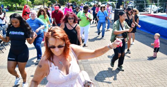 The electric slide and the cupid shuffle got everyone involved in the fun at the Federal Way Community Festival. Photo by Bruce Honda