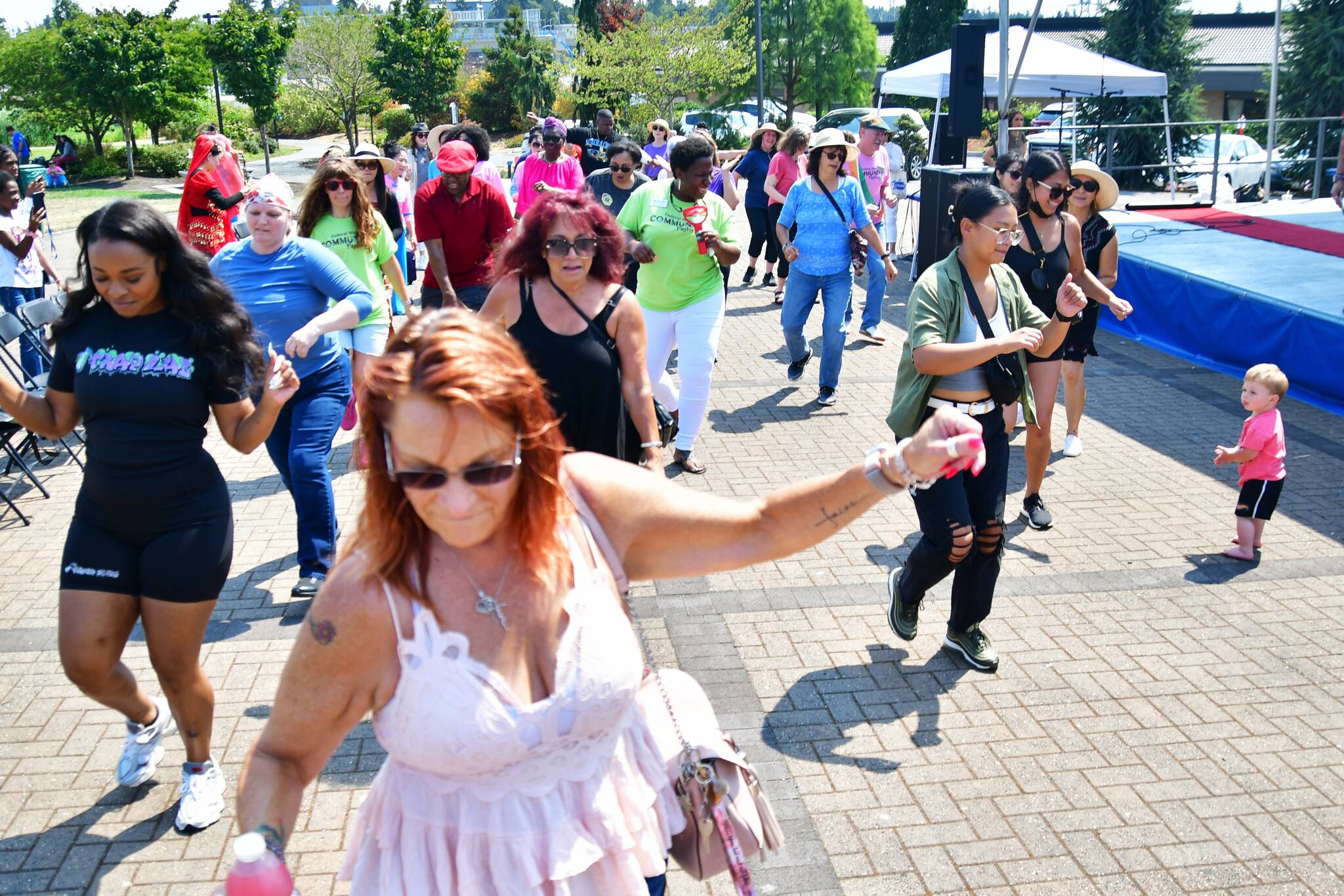 The electric slide and the cupid shuffle got everyone involved in the fun at the Federal Way Community Festival. Photo by Bruce Honda