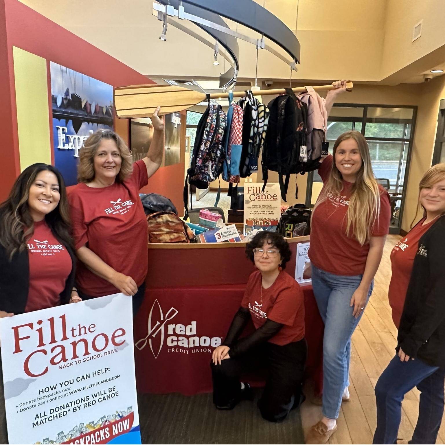 Federal Way staff of Red Canoe showing their backpack donation to the 2023 drive. Employees overall make up one of the largest group of donors. Photo provided by Red Canoe