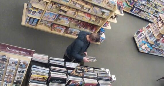 Man stealing records from Barnes and Noble in Federal Way. (Screenshot from surveillance video)