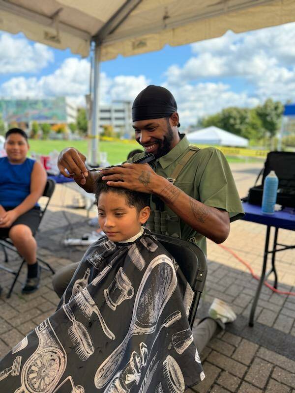 On Aug. 27 at Town Square Park in Federal Way, the Back 2 School Free Haircuts event returned, where students ages 5 to 18 could get their hair cut for free. About 325 students got a free haircut at the event. Photo provided by Bella Red