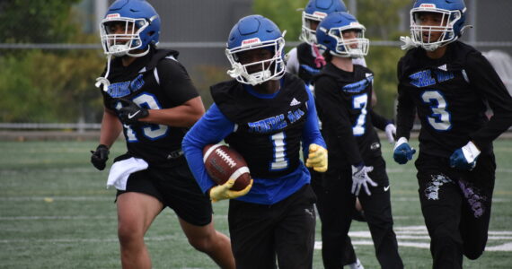 Zamarie Tellez leads a flock of Eagles after an interception during practice. Ben Ray / The Mirror