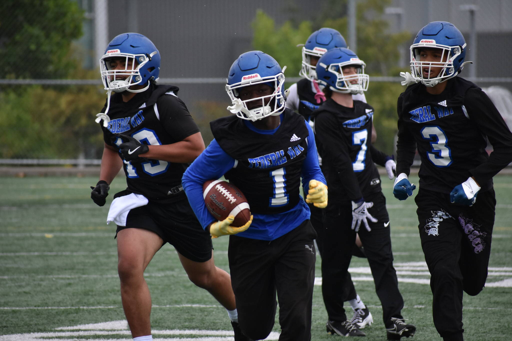 Zamarie Tellez leads a flock of Eagles after an interception during practice. Ben Ray / The Mirror