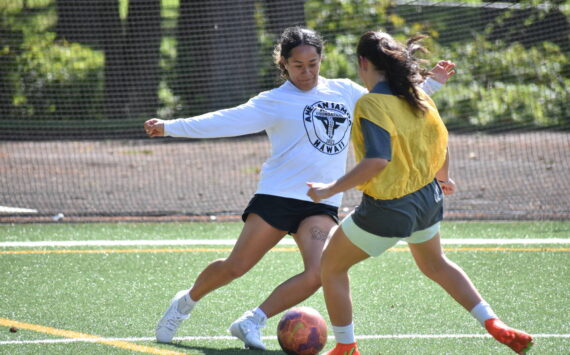 Decatur softball shortstop Kahea Sharpe (white) is giving soccer a go this year. Ben Ray / The Mirror