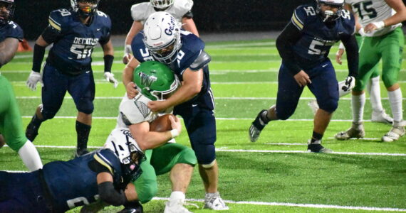 Decatur’s Ben Ferrell takes down the Woodinville running back. Ben Ray / The Mirror