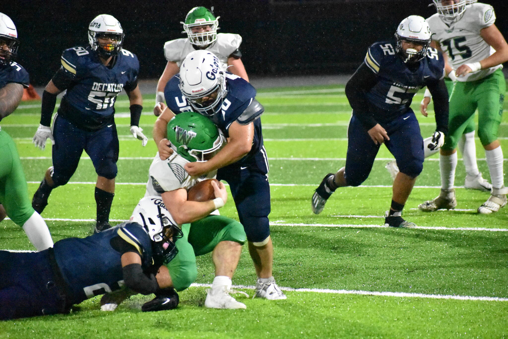 Decatur’s Ben Ferrell takes down the Woodinville running back. Ben Ray / The Mirror