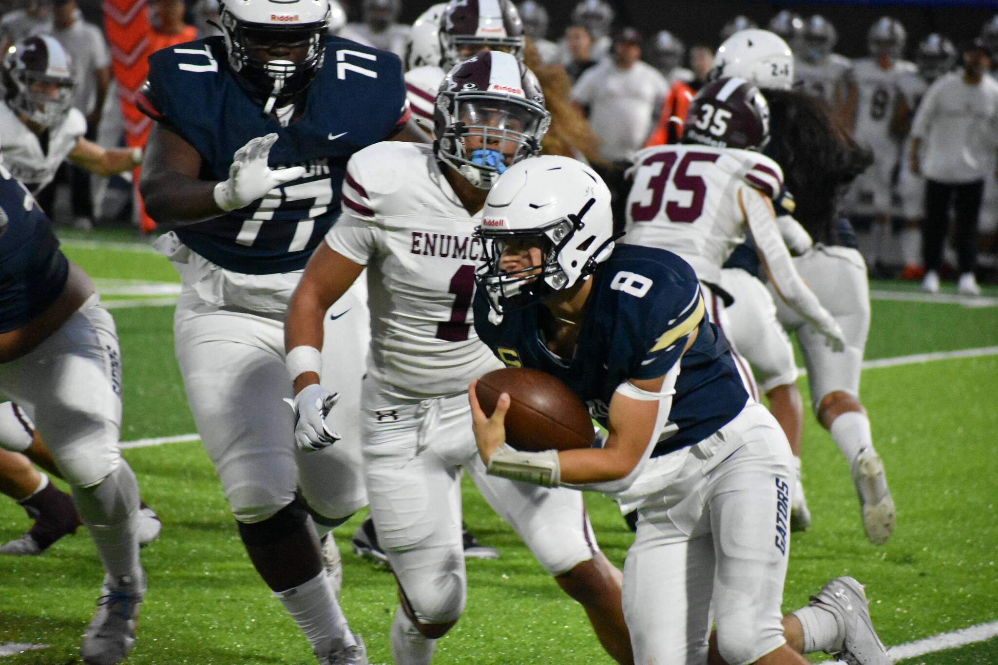 Decatur quarterback Spencer Holloway runs with the the ball against Enumclaw. Ben Ray / The Mirror