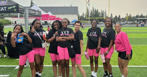 The Phenomenal She Dance Team poses at this year’s Back to School Block Party held by Phenomenal She on Sept. 7 at the Memorial Stadium. The event featured a resource fair, free backpacks, food, free hair cuts and more. Photo provided by Phenomenal She.