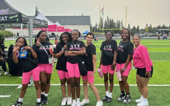 The Phenomenal She Dance Team poses at this year’s Back to School Block Party held by Phenomenal She on Sept. 7 at the Memorial Stadium. The event featured a resource fair, free backpacks, food, free hair cuts and more. Photo provided by Phenomenal She.