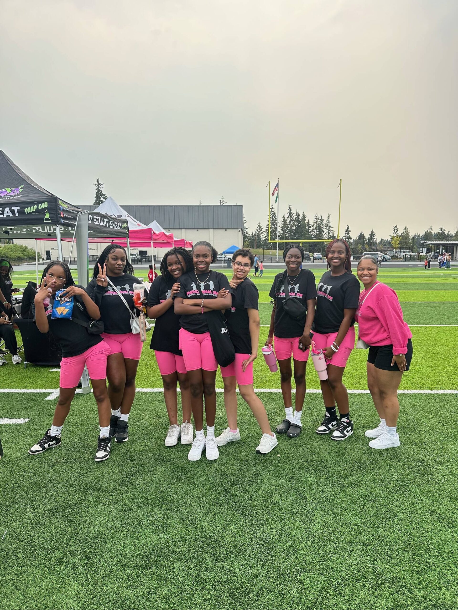 The Phenomenal She Dance Team poses at this year’s Back to School Block Party held by Phenomenal She on Sept. 7 at the Memorial Stadium. The event featured a resource fair, free backpacks, food, free hair cuts and more. Photo provided by Phenomenal She.