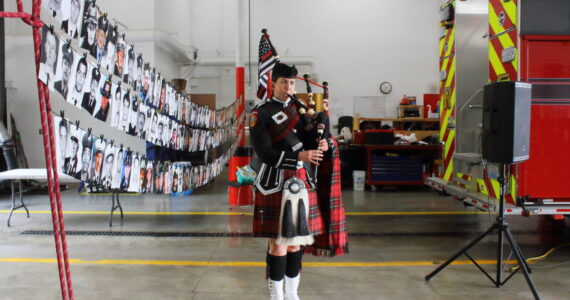 Lt. Ann Hoag of South King Fire is part of Puget Sound Firefighters Pipes and Drums and performed after a moment of silence at the 9/11 memorial tribute event this year. Photo by Keelin Everly-Lang / the Mirror